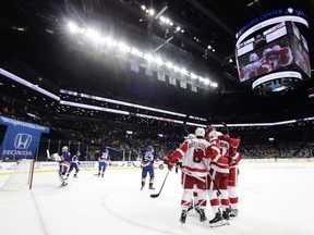 The Detroit Red Wings celebrate a goal by Gustav Nyquist during the first period of an NHL hockey game against the New York Islanders, Tuesday, Dec. 19, 2017, in New York.