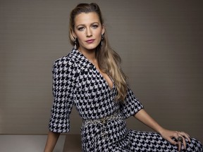 FILE - In this Oct. 16, 2017 file photo, Blake Lively poses for a portrait in New York to promote her latest film, "All I See Is You," where she plays a blind woman who regains her sight. Production has been halted on the action-thriller film "The Rhythm Section" after actress Lively was injured on set. Producers said in a statement Monday, Dec. 4, that Lively hurt her hand while performing an action sequence. Filming was temporarily suspended. Producers said it would resume as soon as possible.