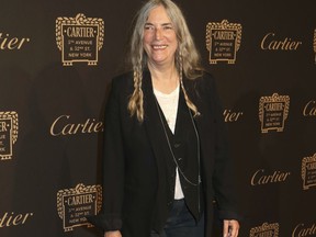 FILE - In this Sept. 7, 2016 file photo, Patti Smith attends the Cartier Fifth Avenue Mansion grand reopening celebration in New York. Smith and Salman Rushdie have compared notes on everything from the writing process to how they cope in the age of President Donald Trump.