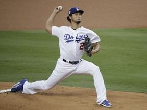 FILE - In this Nov. 1, 2017, file photo, Los Angeles Dodgers starting pitcher Yu Darvish, of Japan, throws against the Houston Astros during the first inning of Game 7 of baseball's World Series in Los Angeles. Free agent pitcher Darvish said Monday, Dec. 18, he had a "very good meeting" with the Chicago Cubs. Darvish tweeted a statement in Japanese confirming the meeting amid reports that Cubs executives Theo Epstein and Jed Hoyer were in Dallas to speak with the right-hander.