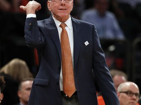 Syracuse head coach Jim Boeheim motions to players during the first half of an NCAA college basketball game against Connecticut, Tuesday, Dec. 5, 2017, in New York.