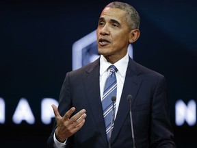 FILE- In this Dec. 2, 2017, photo former President Obama gives a speech in Paris. Obama is expected to attend a gathering of mayors from around the globe convening in Chicago to discuss climate change after President Donald Trump said the U.S. will pull out of the Paris climate accord. Chicago Mayor Rahm Emanuel released a statement Monday, Dec. 4, saying he's honored Obama will be joining the North American Climate Summit Chicago.