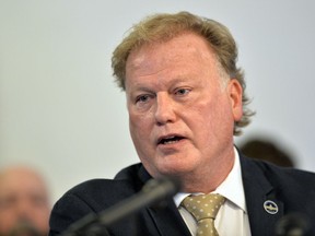CORRECTS TO A PROBABLE SUICIDE INSTEAD OF COMMITTED SUICIDE  FILE - In this Tuesday, Dec. 12, 2017, file photo, Kentucky State Rep. Republican Dan Johnson addresses the public from his church regarding sexual assault allegations in Louisville, Ky. Johnson died Wednesday night, Dec. 13, 2017. Bullitt County Coroner Dave Billings says it was "probably suicide," and an autopsy is scheduled for Thursday morning.