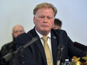 CORRECTS TO A PROBABLE SUICIDE INSTEAD OF COMMITTED SUICIDE   FILE - In this Tuesday, Dec. 12, 2017, file photo, Kentucky State Rep. Republican Dan Johnson addresses the public from his church regarding sexual assault allegations in Louisville, Ky. Johnson died Wednesday night, Dec. 13, 2017. Bullitt County Coroner Dave Billings says it was "probably suicide," and an autopsy is scheduled for Thursday morning.