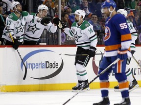 Dallas Stars right wing Alexander Radulov (47) congratulate Stars left wing Jamie Benn (14) after Benn scored a goal during the second period of an NHL hockey game against the New York Islanders in New York, Wednesday, Dec. 13, 2017. The Stars defeated the Islanders 5-2.
