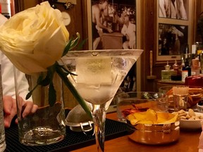 In this Sept. 15, 2017 photo, The "clear" dirty martini is shown and is a signature drink at Bar Hemingway at the Paris Ritz. Hemingway and other notable figures of Paris in the early 20th century are said to have drunk here.