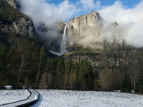 This undated image provided by the National Park Service shows Yosemite Falls in Yosemite National Park in California in winter. The park is less crowded in winter and offers solitude, scenery and activities like hiking, snowshoeing, skiing and ice skating. (NPS Photo via AP)