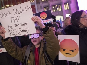 Demonstrators rally in support of Net Neutrality outside a Verizon store, Thursday, Dec. 7, 2017, in New York. The FCC is set to vote Dec. 14 whether to scrap Obama-era rules around open internet access that prevent phone and cable companies from favoring certain websites and apps.