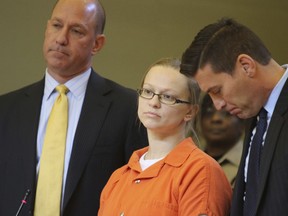 FILE - In this Nov. 8, 2017 file photo, Angelika Graswald stands with her attorneys Jeffrey Chartier, left, and Richard Portale during her sentencing at the Orange County courthouse in Goshen, N.Y.  Graswald, initially charged with murder in the drowning death of her fiance during a New York kayak outing, is being released from prison after pleading guilty to a lesser charge.  Graswald, of Poughkeepsie, admitted she should have perceived the risk of danger and was sentenced in November to 16 months to four years in prison.