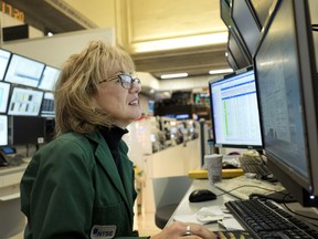 Maria Averna, a lead supervisor for New York Stock Exchange Operations, monitors trading at the exchange, Wednesday, Dec. 27, 2017.