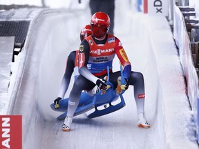 Toni Eggert, front, and Sascha Benecken, of Germany, finish a World Cup luge event in first place in Lake Placid, N.Y., on Friday, Dec. 15, 2017.