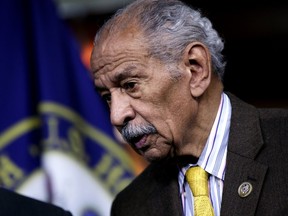 FILE -- In this file photo from Feb. 14, 2017, Rep. John Conyers, D-Mich., attends a news conference on Capitol Hill in Washington. Besieged by allegations of sexual harassment, Conyers resigned from Congress on Tuesday, Dec. 5, 2017, bringing an abrupt end to the civil rights leader's nearly 53-year career on Capitol Hill.