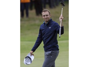 FILE - This July 23, 2017 file photo shows Jordan Spieth, of the United States, celebrating winning the British Open Golf Championships at Royal Birkdale, Southport, England. Spieth revealed the story behind him telling his caddie to "Go get that!" when he made a pivotal eagle putt in the final round.