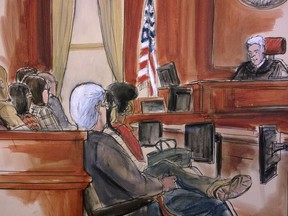 In this courtroom drawing, Judge Richard Berman addresses the jury at the end of the day's deliberations in the corruption trial of Halkbank executive Mehmet Hakan Atilla, Friday, Dec. 22, 2017. Atilla is charged with helping Iran overcome U.S. economic sanctions to launder billions of dollars through world banks, including banks in the United States. Jury deliberations resume on Wednesday, Jan. 3, 2018.