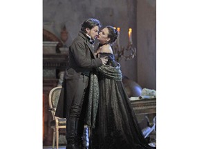 In this Dec. 21, 2017 photo provided by the Metropolitan Opera, Vittorio Grigolo, left, appears as the painter Mario Cavaradossi and Sonya Yoncheva is Floria Tosca in a dress rehearsal for the Met's new production of Puccini's opera "Tosca." The opera, which premiered in 1900, sparked histrionics at its 2009 opening when Luc Bondy's stark staging was met by loud and sustained booing. Sir David McVicar's more lavish production of "Tosca" opens at the Metropolitan Opera on New Year's Eve.