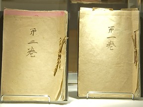 In this image from an Associated Press video, post-World War II memoirs composed by Japanese Emperor Hirohito are displayed at Bonham's Monday, Dec. 4, 2017, in New York. The two-volume, 173 page document, was dictated by the emperor to several aides after the war and transcribed word-for-word by a senior diplomat. It was created at the request of Gen. Douglas MacArthur, whose administration controlled Japan at the time. The memoir, also known as the imperial monologue, covers events from the Japanese assassination of Manchurian warlord Zhang Zuolin in 1928 to the emperor's surrender broadcast recorded on Aug. 14, 1945. It is expected to fetch between $100,000 and $150,000 at Bonhams' auction Dec. 6.
