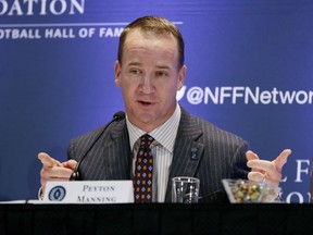 CORRECTS SPELLING TO PEYTON, NOT PAYTON - Former University of Tennessee football quarterback Peyton Manning answers questions during a news conference of the National Football Foundation College and Football Hall of Fame, in New York, Tuesday, Dec. 5, 2017.