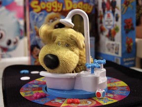 This Tuesday, Sept. 26, 2017, photo shows the Soggy Doggy game from Ideal on display at the 2017 TTPM Holiday Showcase in New York. Soggy Doggy, by toymaker Spin Master, features a plastic dog in a bathtub that shakes water on players.