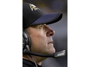 FILE - In this Dec. 10, 2017, file photo,  Baltimore Ravens head coach John Harbaugh watches from the sideline during an NFL football game against the Pittsburgh Steelers in Pittsburgh. There's no easy road to the AFC playoffs. But the Baltimore Ravens are facing a three-week pathway to the postseason deprived of danger. Don't tell Harbaugh that, though.