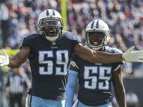 FILE - In this Nov. 5, 2017, file photo, Tennessee Titans inside linebackers Wesley Woodyard (59) and Jayon Brown (55) celebrate a defensive stop during the Titans' 23-20 win over Baltimore, in Nashville. Tennessee linebacker Wesley Woodyard went vegetarian after finally getting a taste of the delicious burgers his teammates ate in the locker room. He has plenty of company on defense with 11 Titans jumping on the plant-based diet with lunches delivered by the Cordon Bleu-trained wife of linebacker Derrick Morgan.