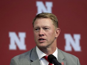 FILE - In a Sunday, Dec. 3, 2017 file photo, new Nebraska head NCAA college football coach Scott Frost speaks during a news conference in Lincoln, Neb. Frost, Georgias Kirby Smart and Clemson's Dabo Swinney are the finalists for The Associated Press Coach of the Year award. The winner will be announced Monday, Dec. 18. Frost led UCF to an unbeaten regular season before taking the Nebraska job.