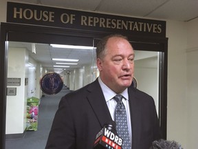 FILE - In a Tuesday, Aug. 29, 2017 file photo, Kentucky House Speaker Jeff Hoover speaks with reporters following a closed-door meeting of House members to discuss the state's pension systems, in Frankfort, Ky. The spokeswoman for Kentucky House Republicans says former GOP speaker Hoover had a sexual relationship with a woman in the office and used money from political donors to pay her as part of a secret settlement outside of court. Daisy Olivo filed a lawsuit Monday, Dec. 4, 2017,  in Franklin Circuit Court. Hoover resigned his leadership position last month  after acknowledging the settlement.