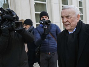 Jose Maria Marin, of Brazil, right, is followed by reporters as he arrives to federal court in the Brooklyn borough of New York, Wednesday, Dec. 13, 2017. Closing arguments are set to take place in the New York trial of three former South American soccer officials charged in the bribery scandal engulfing the sport's governing body.