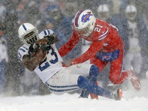 Buffalo Bills free safety Jordan Poyer, right, tackles Indianapolis Colts running back Frank Gore during the second half of an NFL football game, Sunday, Dec. 10, 2017, in Orchard Park, N.Y.