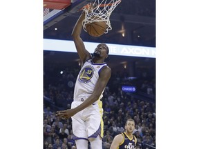 Golden State Warriors forward Kevin Durant (35) dunks against the Utah Jazz during the first half of an NBA basketball game in Oakland, Calif., Wednesday, Dec. 27, 2017.