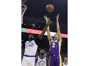 Golden State Warriors forward Draymond Green (23) and Los Angeles Lakers guard Lonzo Ball (2) vie for a rebound during the first half of an NBA basketball game Friday, Dec. 22, 2017, in Oakland, Calif.