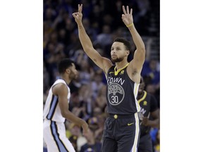 Golden State Warriors guard Stephen Curry (30) gestures after scoring during the first half of the team's NBA basketball game against the Memphis Grizzlies in Oakland, Calif., Saturday, Dec. 30, 2017.