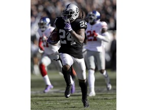 Oakland Raiders running back Marshawn Lynch (24) runs for a touchdown against the New York Giants during the first half of an NFL football game in Oakland, Calif., Sunday, Dec. 3, 2017.
