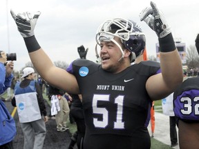 FILE - In this Dec. 12, 2015, file photo, Mount Union lineman Cole Parrish, looks towards the home stands as the final seconds drain from the clock against Wisconsin-Whitewater in the semifinals of an NCAA Division III college football game, in Alliance, Ohio. Mount Union offensive linemen Parrish made the first team on The Associated Press D-III All-America team.