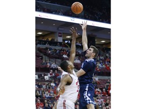 Citadel's Zane Najdawi, right, shoots over Ohio State's Kaleb Wesson during the first half of an NCAA college basketball game Tuesday, Dec. 19, 2017, in Columbus, Ohio.