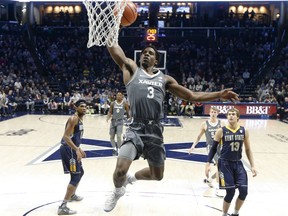 Xavier's Quentin Goodin (3) dunks during the first half of the team's NCAA college basketball game against Kent State, Wednesday, Dec. 6, 2017, in Cincinnati.