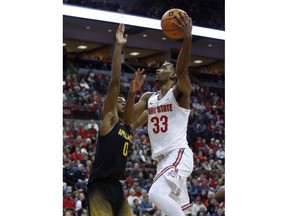 Ohio State forward Keita Bates-Diop, right, goes up to shoot against Appalachian State forward Isaac Johnson during the first half of an NCAA college basketball game in Columbus, Ohio, Saturday, Dec. 16, 2017.