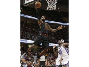 Cleveland Cavaliers' LeBron James (23) drives to the basket against Sacramento Kings' Zach Randolph (50) in the first half of an NBA basketball game, Wednesday, Dec. 6, 2017, in Cleveland.