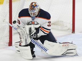 Edmonton Oilers goalie Cam Talbot blocks a shot by the Minnesota Wild in the first period of their game Saturday night in St. Paul, Minn.