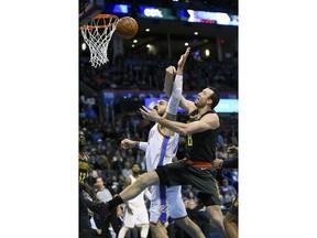 Oklahoma City Thunder's's Steven Adams, left, fights, Atlanta Hawks' Luke Babbitt for a rebound in the first quarter of an NBA basketball game in Oklahoma City, Friday, Dec. 22, 2017.