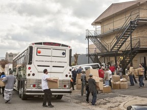 A bus is loaded up as Oklahoma Department of Correction inmates are moved out of the Invahoe and Cameo halfway houses operated by Catalyst Behavioral Services in Oklahoma City, Okla. on Monday, Dec. 4, 2017. The ODOC canceled the contract due to safety concerns with the facility not conducting counts properly, inmates being away from the facility without accountability, and lack of staff training verification.