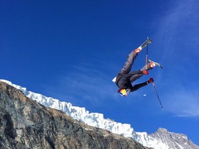 This photo taken from a 4K video and dated Oct. 18, 2017, shows a skier performing a jump during training on the glacier above Saas-Fee, Switzerland.