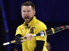 Skip Mike McEwen of Winnipeg pumps his fist after his shot in the ninth end during the men's semifinal against Team Gushue at the 2017 Roar of the Rings Canadian Olympic Trials in Ottawa on Saturday.