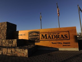 This photo taken Wednesday, Dec. 6, 2017, shows welcome sign heading into the town of Madras, Ore. The town in Central Oregon, which is near an epicenter of America's fascination with microbreweries, is thirsting for a piece of the action and offering incentives for the first brewery to establish itself in the high-desert community.