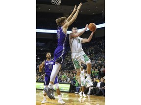 Oregon's Payton Pritchard (3) drives against Central Arkansas center Hayden Koval during an NCAA college basketball game in Eugene, Ore., Wednesday, Dec. 20, 2017.