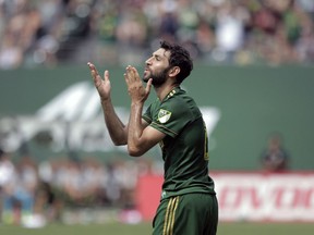 FILE - In this Aug. 6, 2017, file photo, Portland Timbers' Diego Valeri (8) blows kisses to the crowd after scoring a goal in the first half of an MLS soccer match against the Los Angeles Galaxy, in Portland, Ore. Timbers midfielder Diego Valeri has been named Major League Soccer's Most Valuable Player. The 31-year-old native of Argentina had 21 goals and 11 assists this season for Portland, which finished atop the Western Conference. He is the first midfielder in league history with 20 or more goals in a single season and just the second player with at least 20 goals and 10 assists in a single season. His 32 combined goals and assists rank fifth in MLS history.