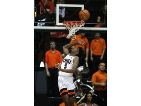 Oregon State's Ethan Thompson (5) watches his shot go into the basket during the first half of an NCAA college basketball game against Colorado in Corvallis, Ore., Friday, Dec. 29, 2017.