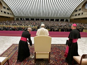 Pope Francis, center, arrives for his weekly general audience in the Paul VI Hall at the Vatican, Wednesday, Dec. 13, 2017. (L'Osservatore Romano/Pool Photo via AP)