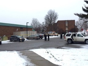 Authorities investigate the scene of a shooting at the Penn State University campus in Beaver County in Monaca, Pa., Wednesday, Dec. 13, 2017. Police say a woman who worked at a Penn State satellite campus was apparently shot dead in the university parking lot by her estranged husband and the man then killed himself.