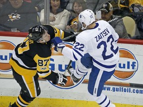 Pittsburgh Penguins' Sidney Crosby (87) collides with Toronto Maple Leafs' Nikita Zaitsev (22) during the first period of an NHL hockey game in Pittsburgh, Saturday, Dec. 9, 2017.