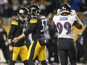 Pittsburgh Steelers kicker Chris Boswell (9) celebrates with long snapper Kameron Canaday (57) after kicking the game-winning field goal during the second half of an NFL football game against the Baltimore Ravens in Pittsburgh, Sunday, Dec. 10, 2017. The Steelers won 39-38.